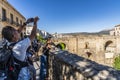 Tourist photographing the New Bridge Ronda Spain