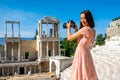 Tourist photographing Roman theater in Plovdiv