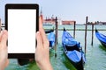 Tourist photographs gondolas on San Marco Canal Royalty Free Stock Photo