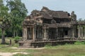 Tourist photographs ruined Angkor Wat stone temple