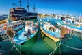 Tourist `Pirate ship` and moored fishing boats in harbour at Ayia Napa. Famagusta District. Cyprus