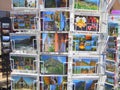 Tourist postcards for sale on rack