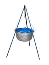 Tourist pot with blue cap hanging on tripod Royalty Free Stock Photo