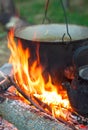 Tourist pot over camp fire Royalty Free Stock Photo