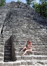 The tourist in pyramid ruins Mexico.