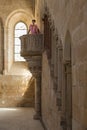 Tourist raised in the pulpit of the refectory, of the monastery