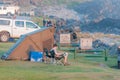 Tourist reading a book at tent