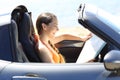 Tourist reading a map inside a car on vacation