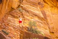 Tourist among red rocks in Zion National Park Royalty Free Stock Photo