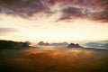 Tourist resort in Saxony. Fantastic dreamy sunrise on the top of the rocky mountain with the view into misty valley Royalty Free Stock Photo