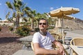 A tourist rests in a beach cafe bar Royalty Free Stock Photo