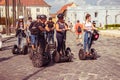 Tourist rides a electric scooter on old square sightseeing europe Royalty Free Stock Photo