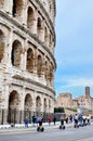 Tourist Rides Electric Scooter Segway on the street past the Coliseum in Rome.