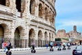Tourist Rides Electric Scooter Segway on the street past the Coliseum in Rome. Royalty Free Stock Photo