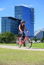 Tourist riding a bike outside Crown Towers luxury hotel in Perth Western Australia