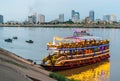 Tourist river cruise boats,lit up at dusk,await customers,Phnom Penh,Cambodia Royalty Free Stock Photo