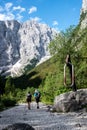 Tourist on a road to Triglav mounain, National Park - Julian Alp