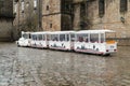 Tourist road train on Obradoiro square on a rainy day