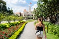 Tourist in Saigon. Tourism and travel in Ho Chi Minh City, Vietnam. Woman and statue. Royalty Free Stock Photo