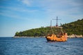 Tourist sailing ship passing Lokrum Island at Dubrovnik in Croatia