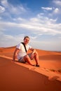 Tourist on a sand dunes Royalty Free Stock Photo