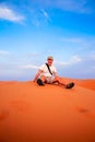 Tourist on a sand dunes Royalty Free Stock Photo