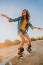 Tourist Sandboarding girl In the Desert Man jumps in and does the trick Royalty Free Stock Photo