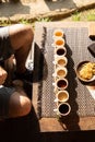 Tourist sat to taste different kinds of indonesian coffee at a touristic coffee plantation, Bali, Indonesia