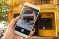 Tourist Selfie photo of yellow old house at Walking on streets of Hoi An, Hoi An is culture, heritage UNESCO World Heritage Site Royalty Free Stock Photo