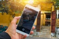 Tourist  Selfie photo of yellow old house at Walking on streets of Hoi An, Hoi An is culture, heritage UNESCO World Heritage Site Royalty Free Stock Photo