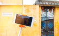 Tourist  Selfie photo of yellow old house at Walking on streets of Hoi An, Hoi An is culture, heritage UNESCO World Heritage Site Royalty Free Stock Photo