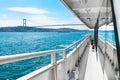 Tourist ship on the Boshporus in Istanbul, Turkey. View of the Boshporus bridge