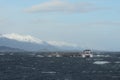 Tourist ship near the island with the sea lions in the Beagle channel. Royalty Free Stock Photo