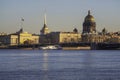 Tourist ship is sailing under the bridge. Spring St. Petersburg with a view of St. Isaac\'s Cathedral.