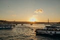 Tourist ship sails on the Golden Horn, scenic sunny beautiful waterfront of Istanbul city at sunset in summer