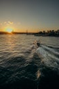 Tourist ship sails on the Golden Horn, scenic sunny beautiful waterfront of Istanbul city at sunset in summer