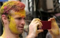 Tourist shoot Hindus celebrate Holi or indian hindu festival of colors an annual event