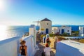 Tourist sightseeing picturesque Oia clifftop Santorini island Greece Royalty Free Stock Photo