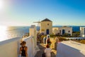 Tourist sightseeing picturesque Oia clifftop Santorini island Greece Royalty Free Stock Photo