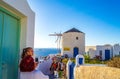 Tourist sightseeing picturesque Oia clifftop Santorini island Greece Royalty Free Stock Photo