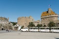 Tourist sightseeing train waits for passengers outside the city walls of the old town of Saint-Malo in Brittany