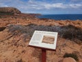 Tourist sign Kalbarri Western Australia rugged coast line Red Bluff Royalty Free Stock Photo