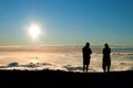 Tourist silhouette watching sunset on the top of Haleakala volc