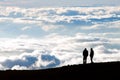 Tourist silhouette watching sunset on the top of Haleakala volc