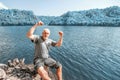 A tourist sits on the bank of the Yumaguzinsky reservoir on the Belaya River. Royalty Free Stock Photo