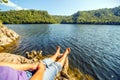 A tourist sits on the bank of the Yumaguzisky reservoir Royalty Free Stock Photo