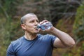 tourist sits and drinks water