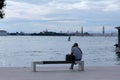 Tourist sitting on a bench in Venice, Italy