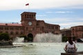 Tourist sitting in front of the fountain. Republic square. Yerevan. Armenia