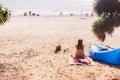 Tourist sitting for taking a rest at `Kata Noi` beach, Phuket, Thailand